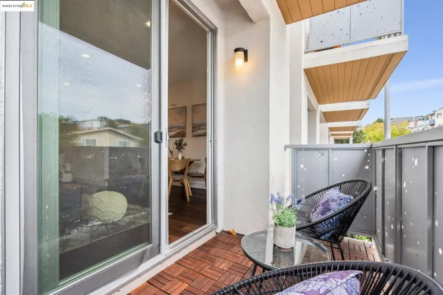 a living room with furniture kitchen and a table