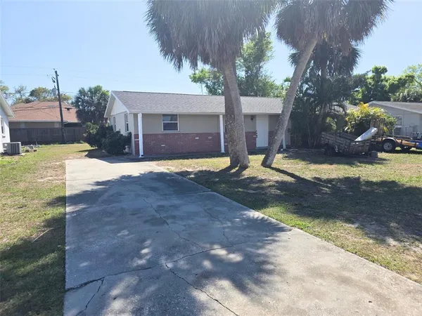 a view of a backyard of the house