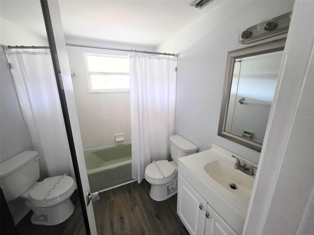 546 Briarwood Road Venice, FL 34293 - Photo 14 of 20 a white toilet sitting next to a bathroom sink