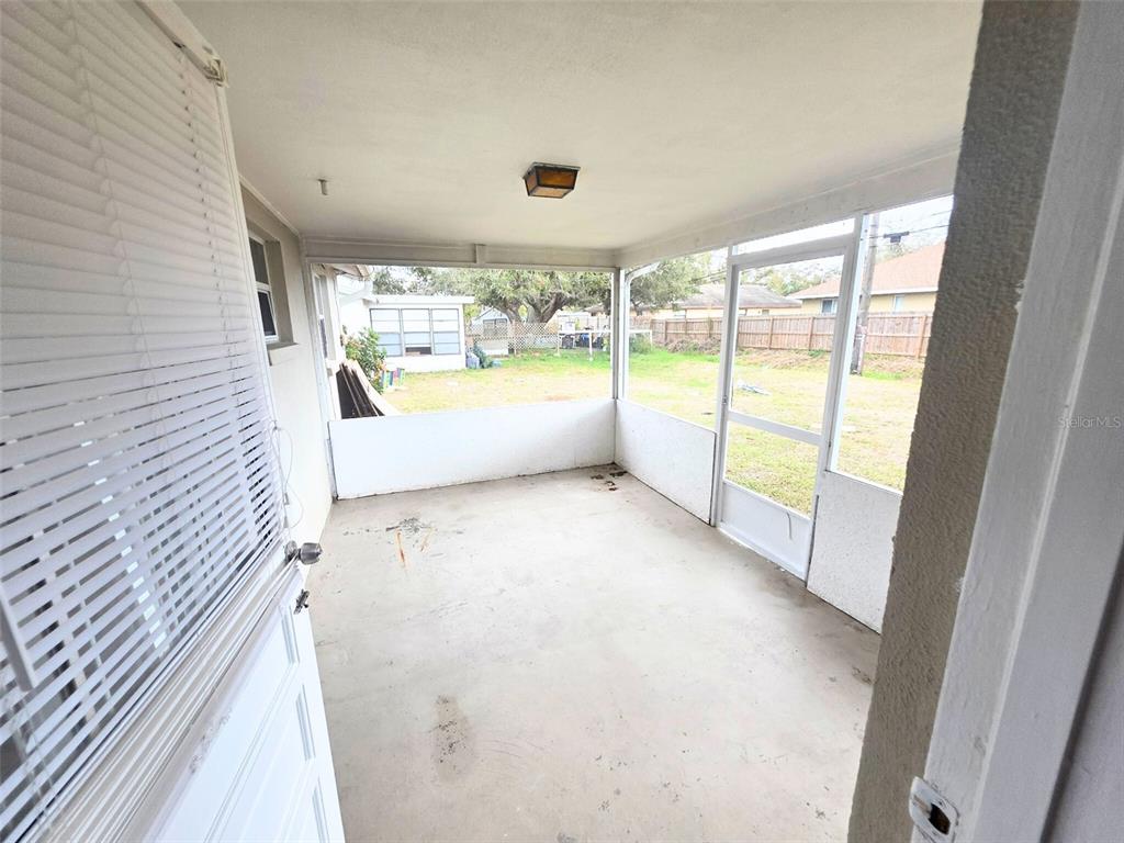 546 Briarwood Road Venice, FL 34293 - Photo 18 of 20 a view of an empty room and a large window