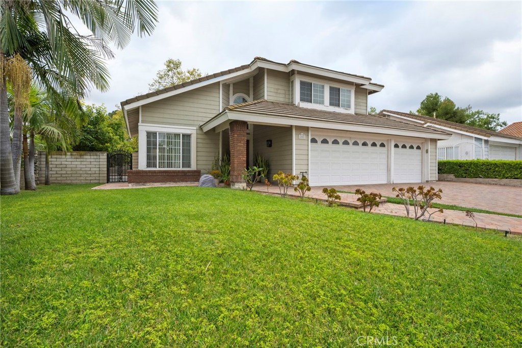 605 Bronco Way Walnut, CA 91789 - Photo 3 of 69 a front view of house with yard and outdoor seating
