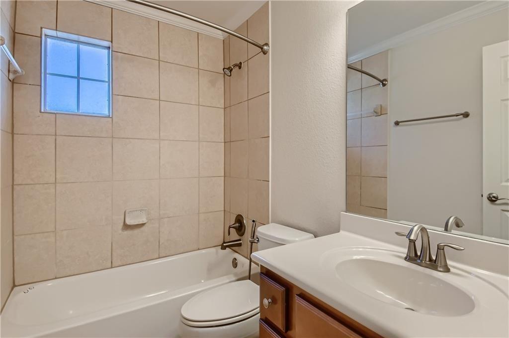 3822 Remington Road Cedar Park, TX 78613 - Photo 24 of 31 a bathroom with a sink a toilet and shower