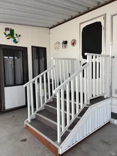 a view of a porch with furniture