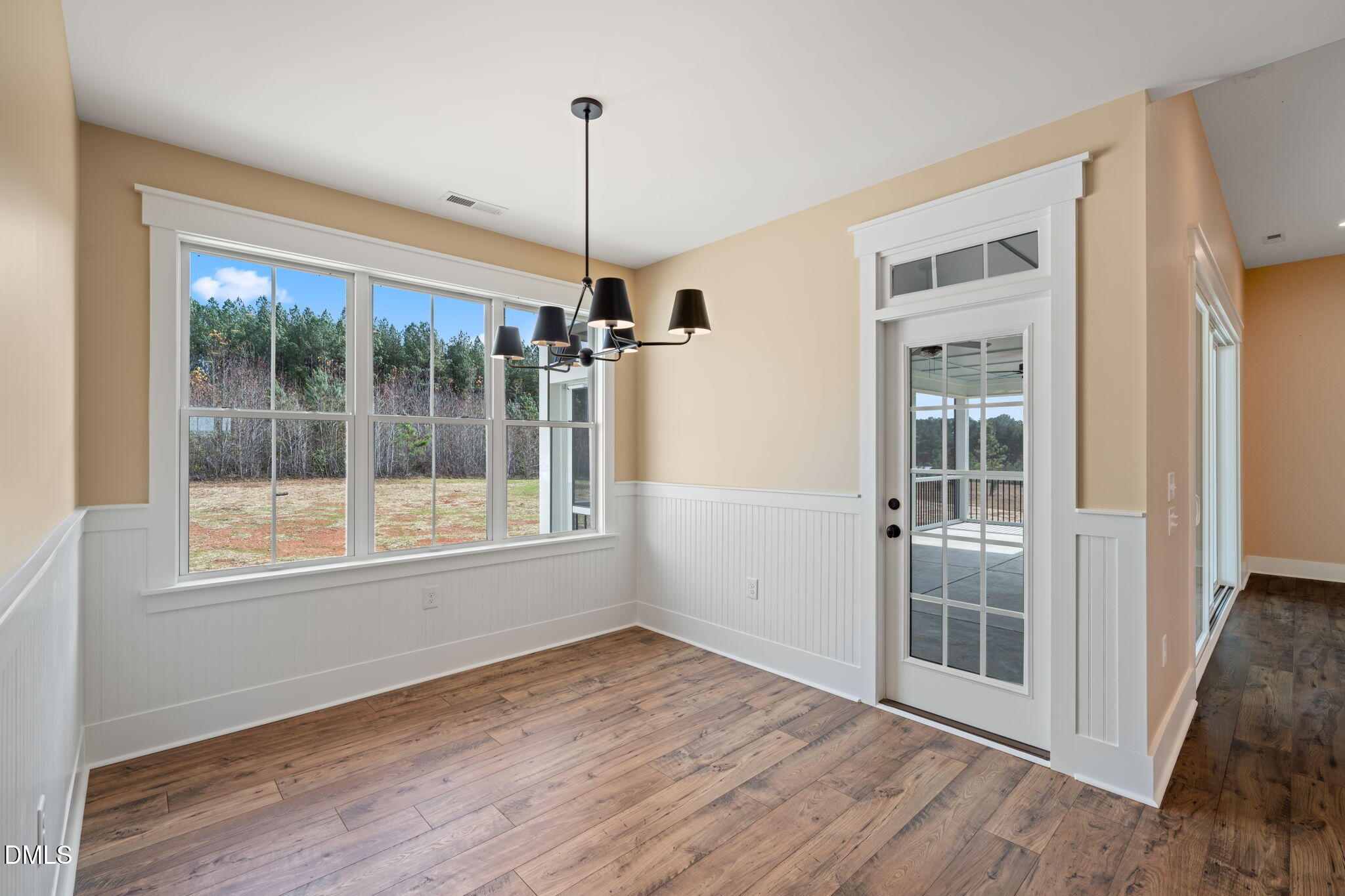13887 Burgess Road Middlesex, NC 27557 - Photo 15 of 45 a view of an empty room with wooden floor and a window