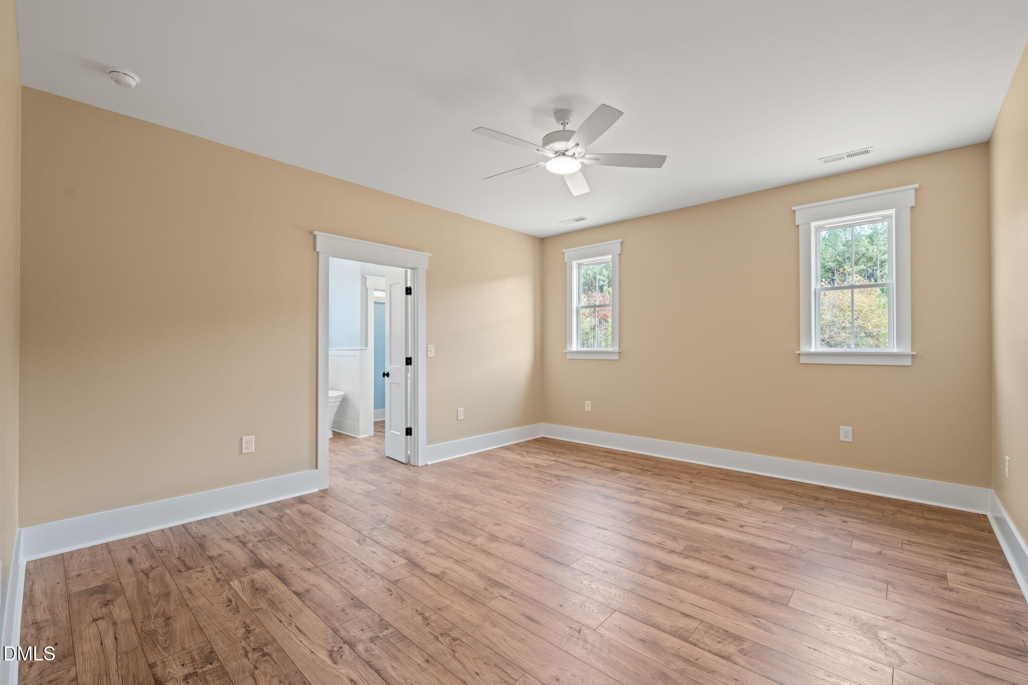 13887 Burgess Road Middlesex, NC 27557 - Photo 19 of 45 a view of an empty room with wooden floor and a window