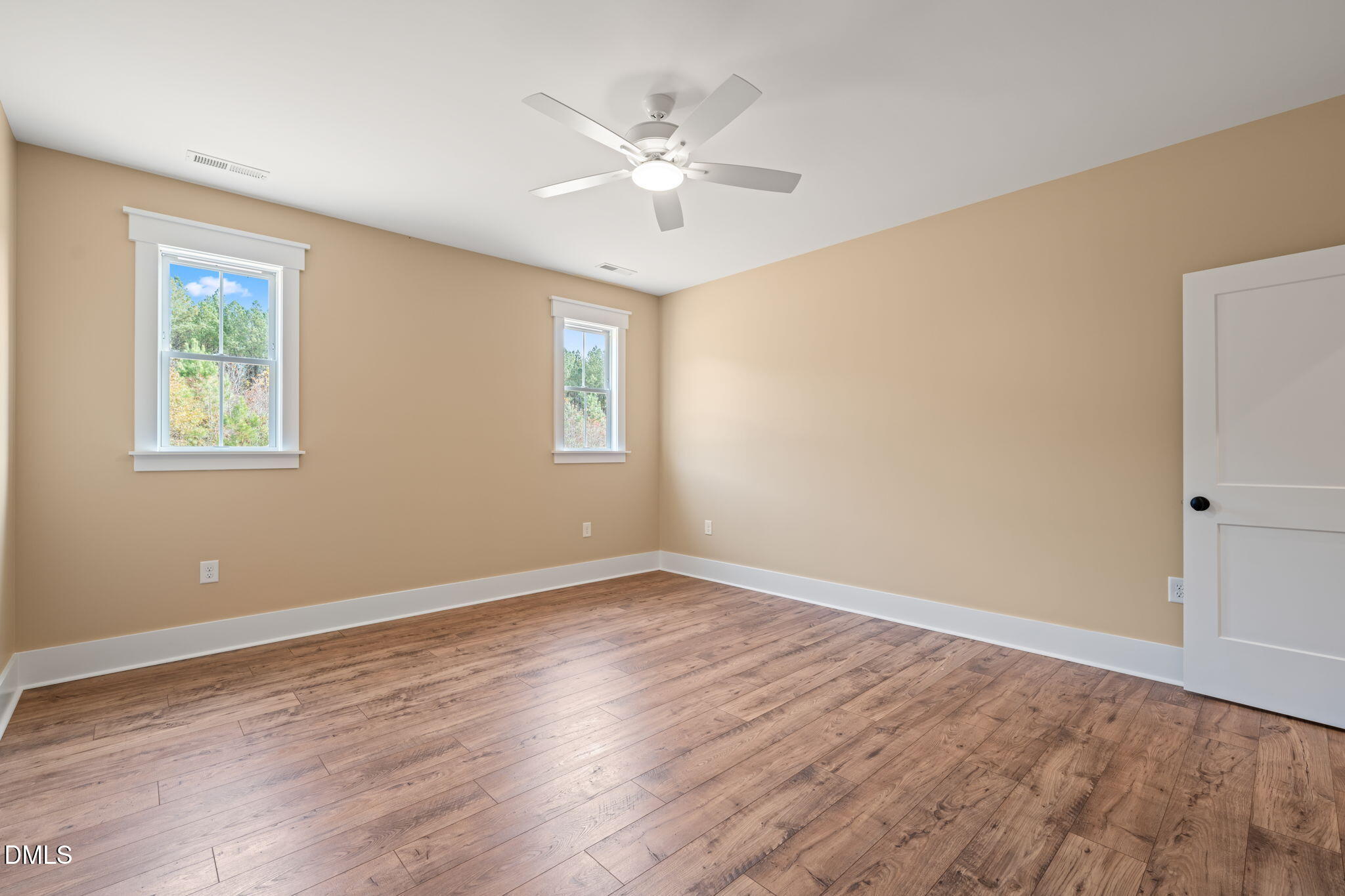 13887 Burgess Road Middlesex, NC 27557 - Photo 20 of 45 a view of an empty room with wooden floor and a window