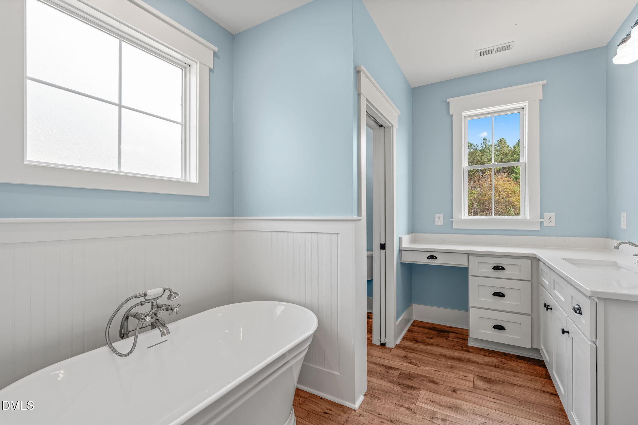 13887 Burgess Road Middlesex, NC 27557 - Photo 28 of 45 a bathroom with a sink a window and a mirror