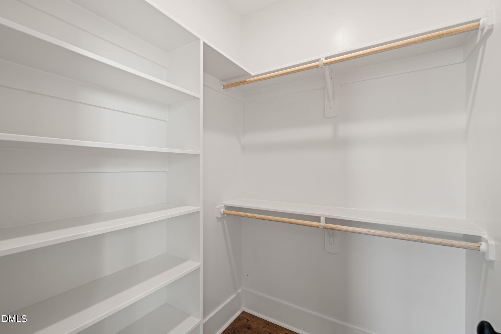 13887 Burgess Road Middlesex, NC 27557 - Photo 34 of 45 a view of walk in closet with empty racks