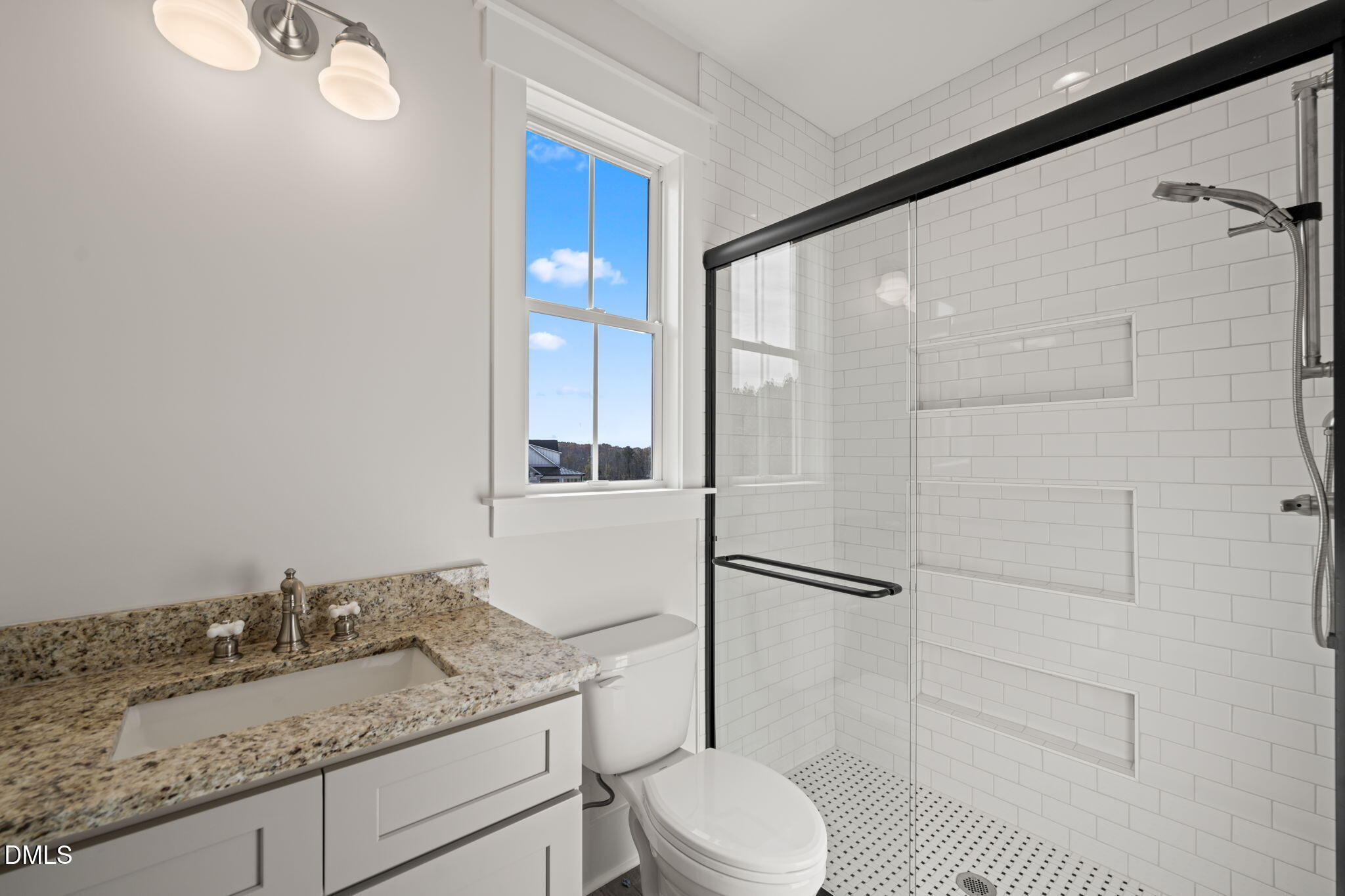 13887 Burgess Road Middlesex, NC 27557 - Photo 35 of 45 a bathroom with a granite countertop sink toilet and shower