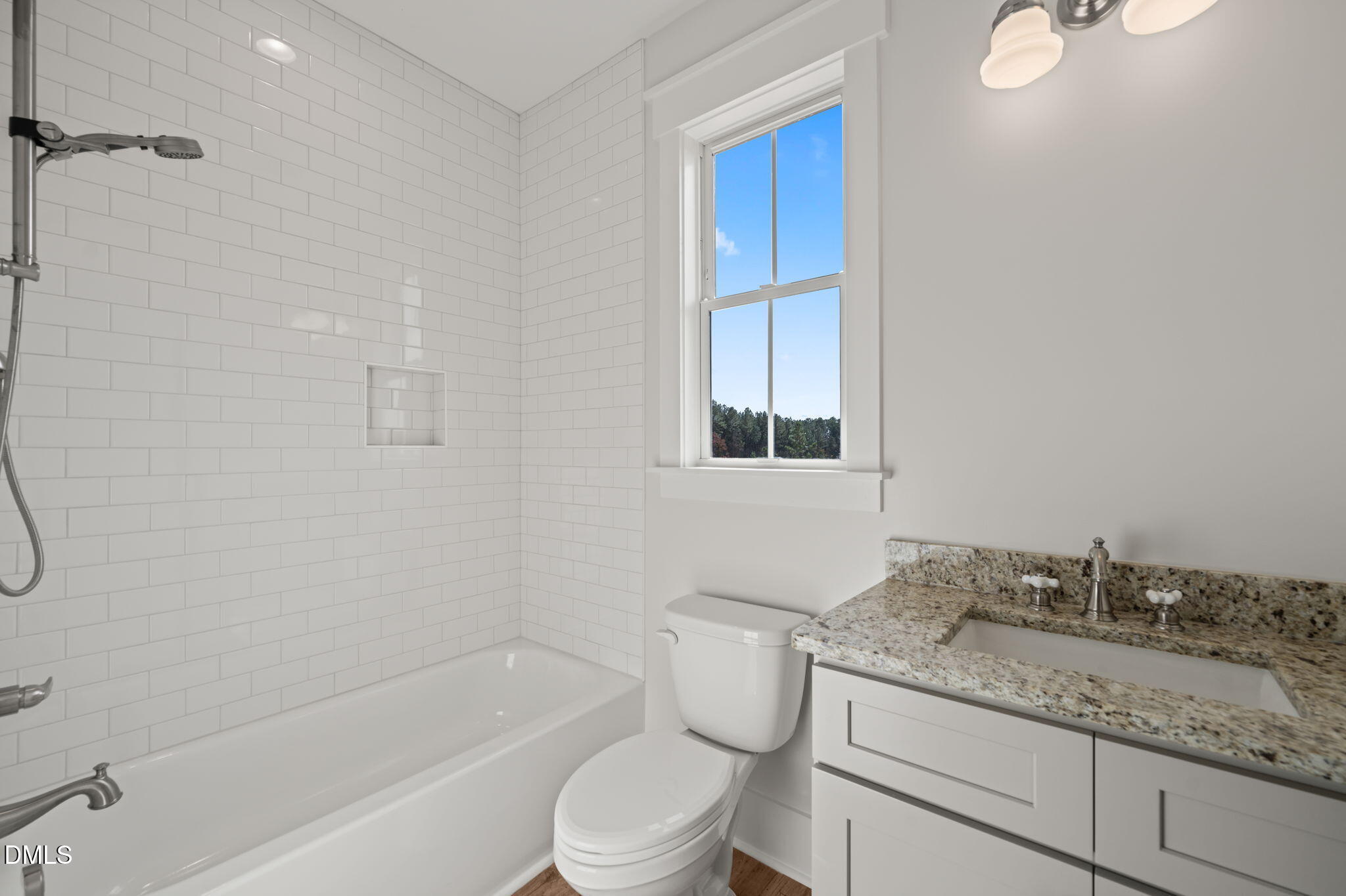 13887 Burgess Road Middlesex, NC 27557 - Photo 38 of 45 a bathroom with a granite countertop sink toilet and shower