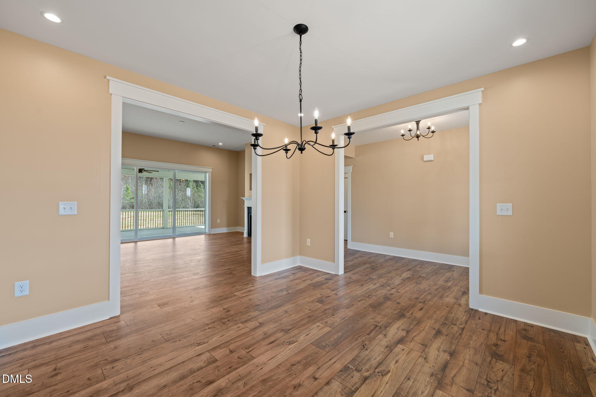 13887 Burgess Road Middlesex, NC 27557 - Photo 7 of 45 a view of a livingroom with wooden floor staircase and a chandelier
