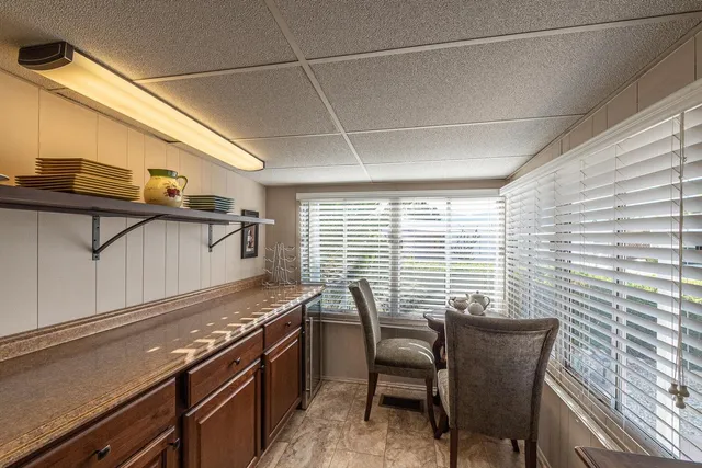 a kitchen with a sink and a refrigerator