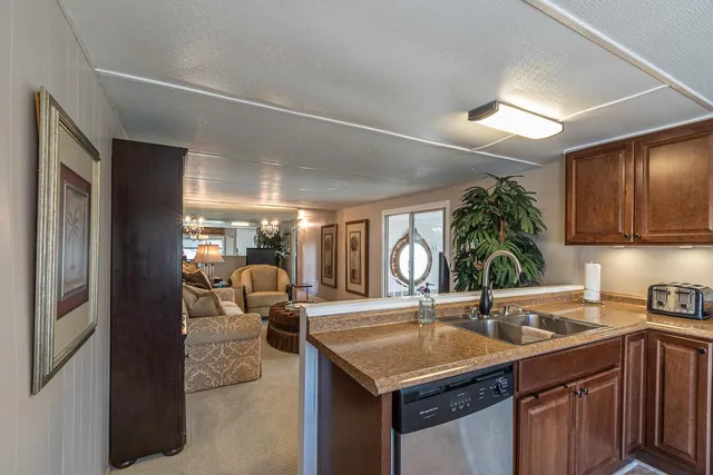 a living room with furniture ceiling fan and a window