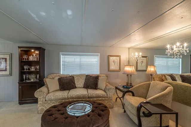 a living room with furniture and stairs