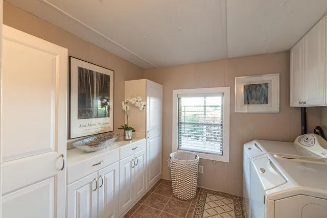 a bathroom with a sink double vanity and a window