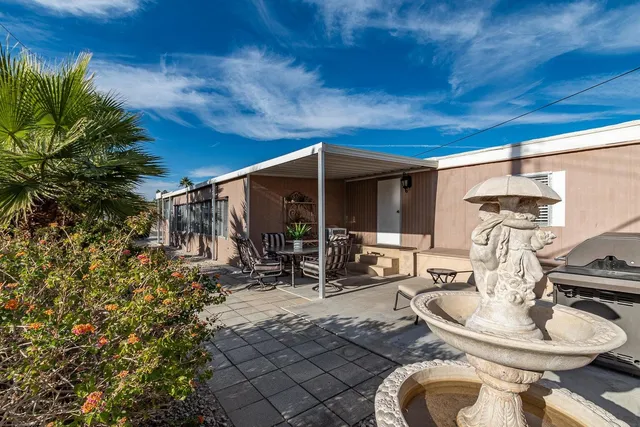 a room with furniture and a large window
