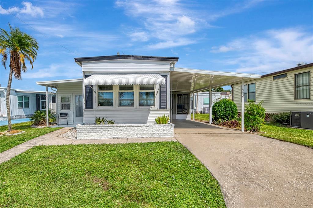 a view of a house with sitting area and garden