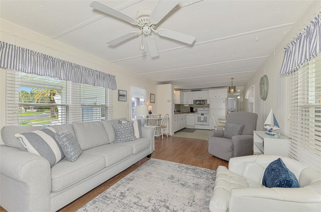 259 Inner Drive East Venice, FL 34285 - Photo 11 of 26 a living room with furniture and a large window