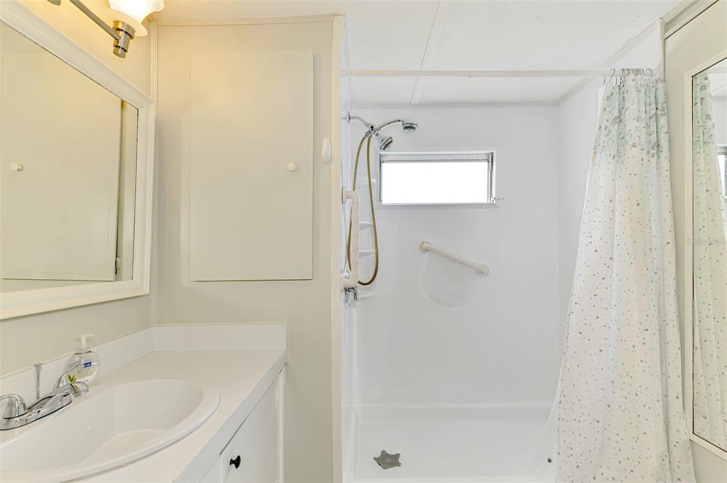 259 Inner Drive East Venice, FL 34285 - Photo 16 of 26 a bathroom with a shower and a sink