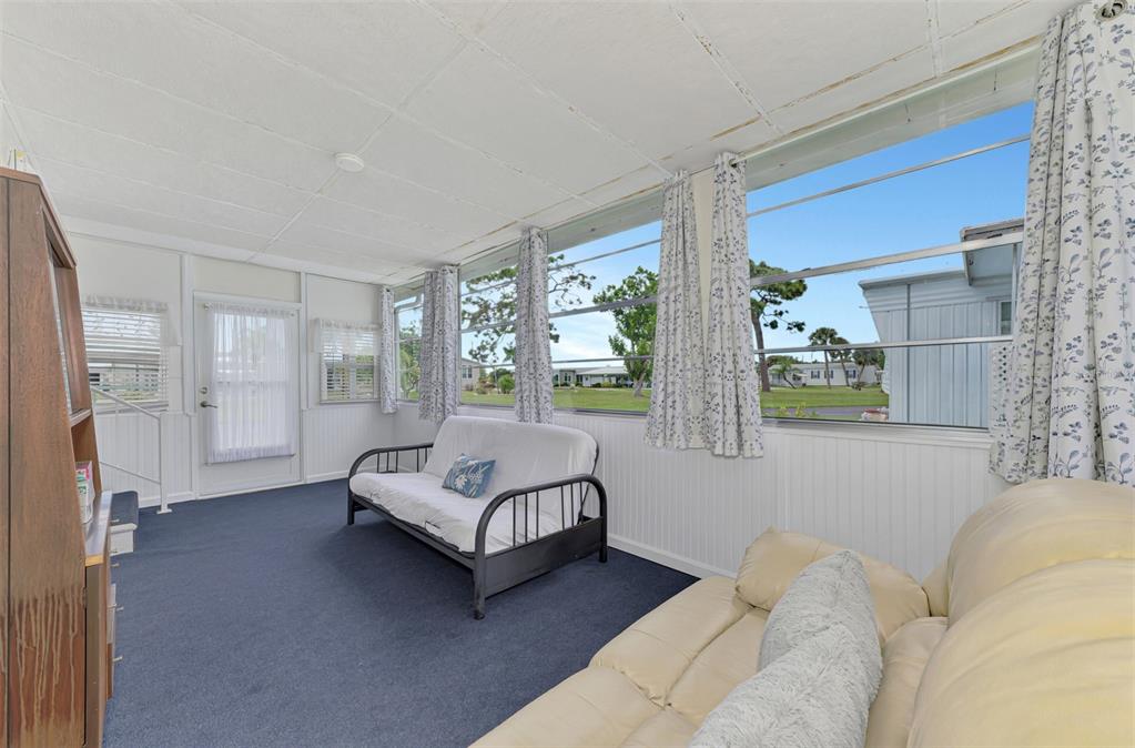 259 Inner Drive East Venice, FL 34285 - Photo 20 of 26 a living room with furniture and a large window