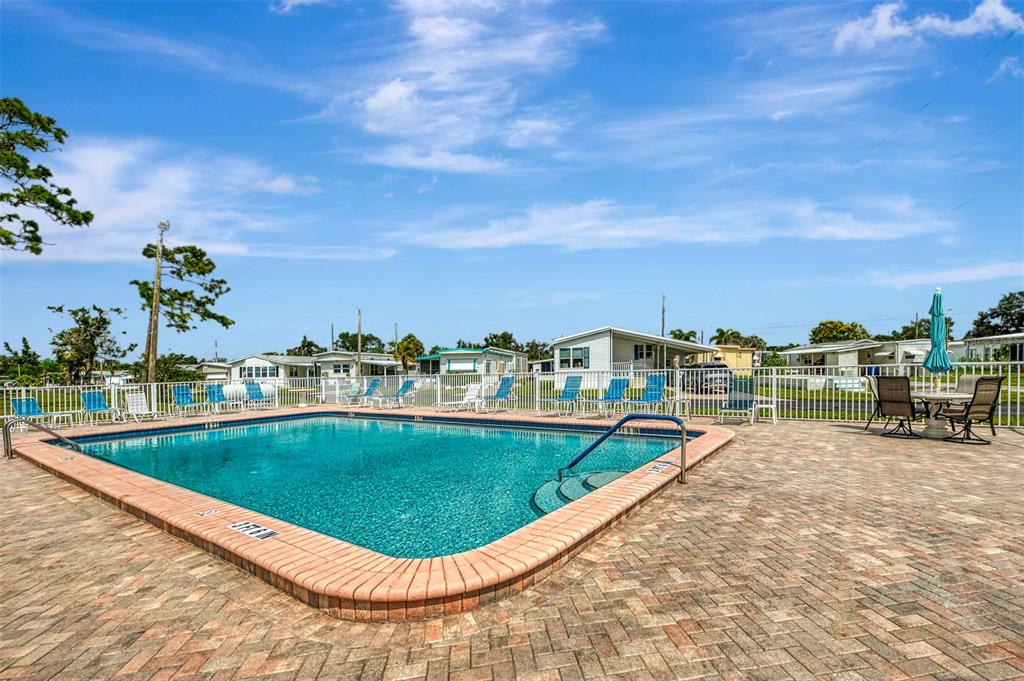 259 Inner Drive East Venice, FL 34285 - Photo 23 of 26 a view of a swimming pool with a lake view