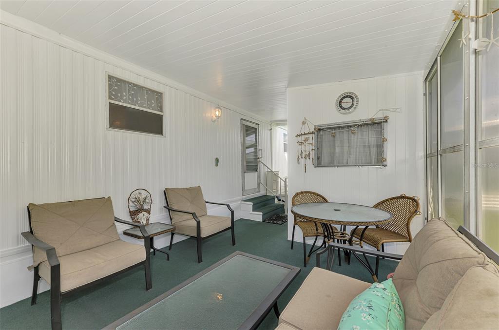 259 Inner Drive East Venice, FL 34285 - Photo 6 of 26 a living room with furniture and a table