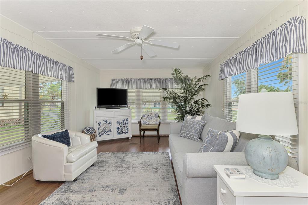 259 Inner Drive East Venice, FL 34285 - Photo 10 of 26 a living room with furniture and a flat screen tv