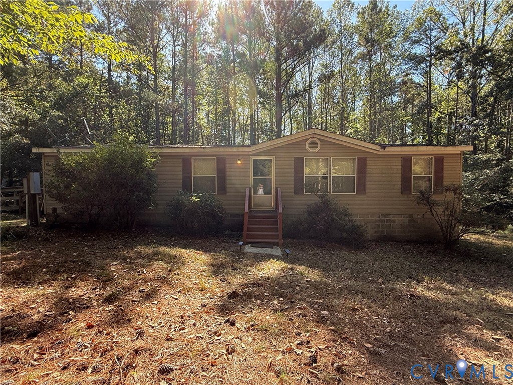 1370 Dorrell Road Aylett, VA 23009 - Photo 1 of 8 a view of a house with a yard