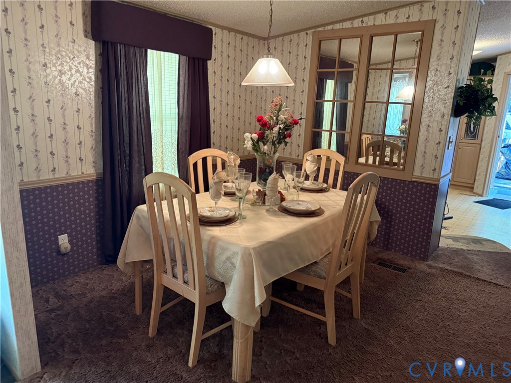 1370 Dorrell Road Aylett, VA 23009 - Photo 8 of 8 a dining room with furniture and window