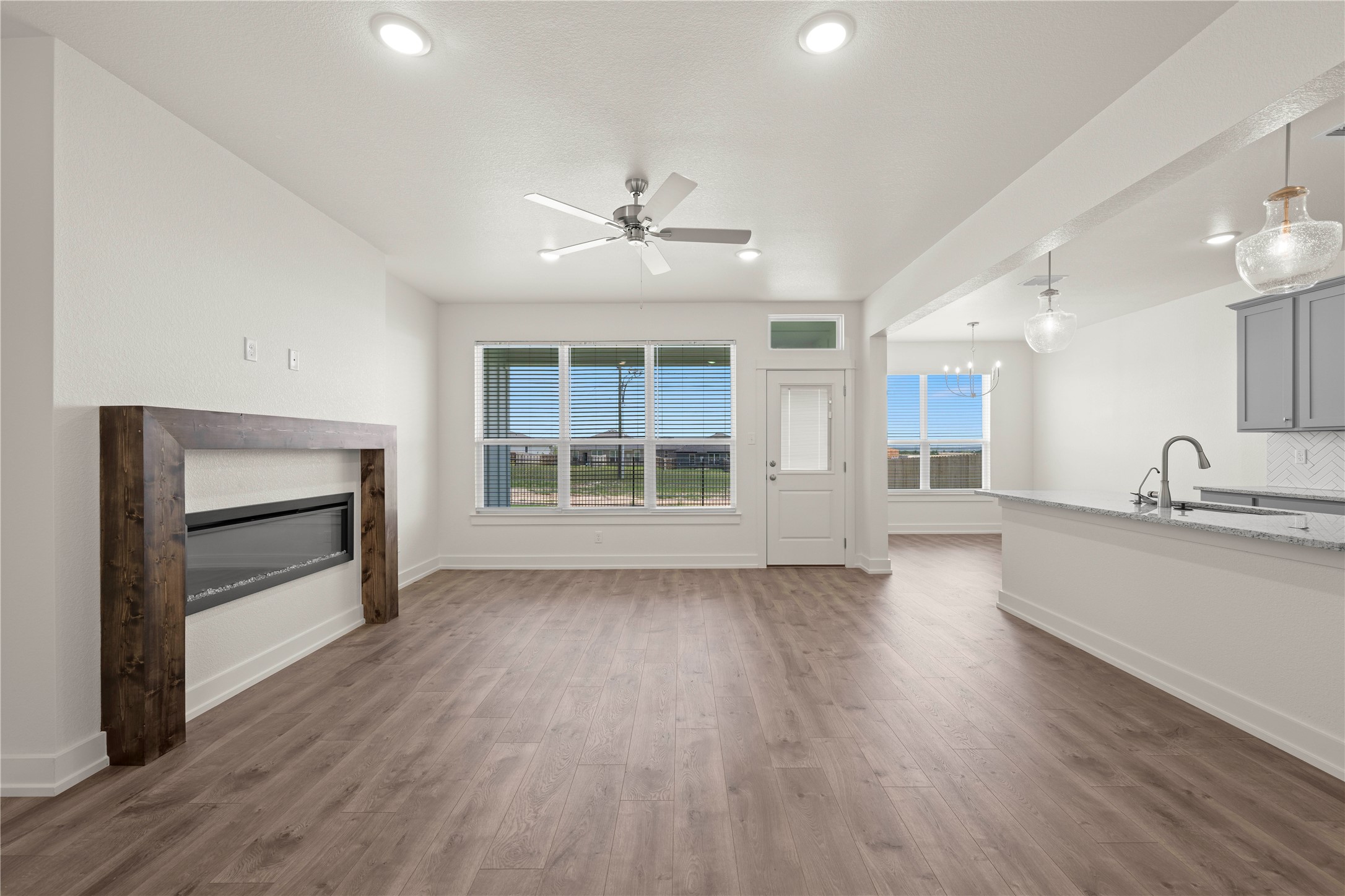 564 Gus Loop Georgetown, TX 78626 - Photo 6 of 32 a view of a kitchen with wooden floor and a kitchen