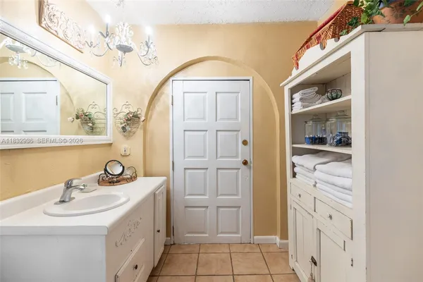 a bathroom with a sink a vanity and a mirror