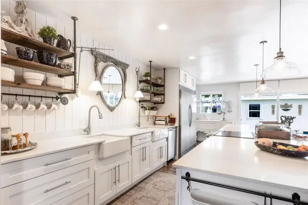 a kitchen with cabinets a sink and a stove
