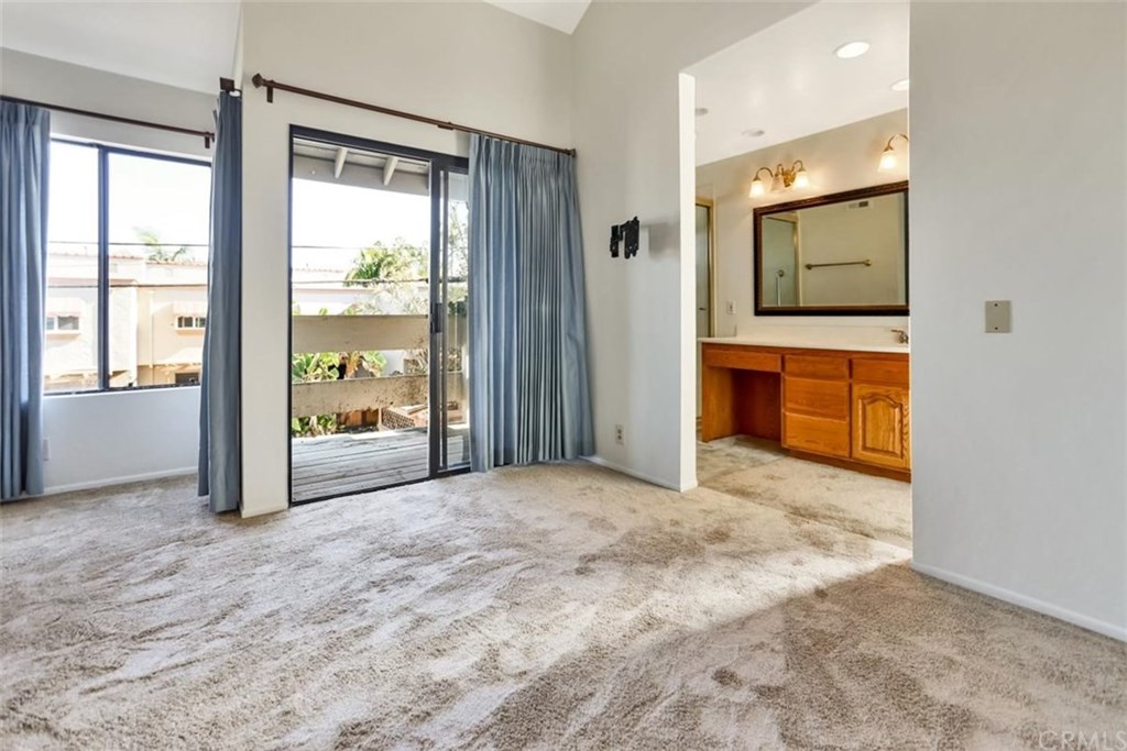 292 Palmer Street, Unit C2 Costa Mesa, CA 92627 - Photo 10 of 40 Large Master Bedroom with en suite and step in shower with frameless glass doors.