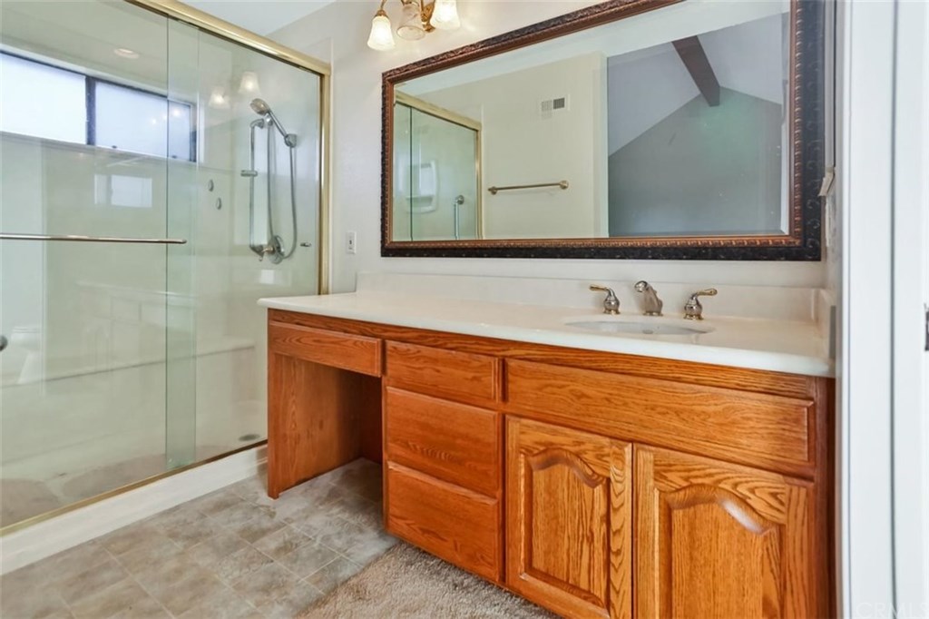 292 Palmer Street, Unit C2 Costa Mesa, CA 92627 - Photo 12 of 40 Master Bedroom on 1st Level large vanity area and step in shower with frameless glass doors.