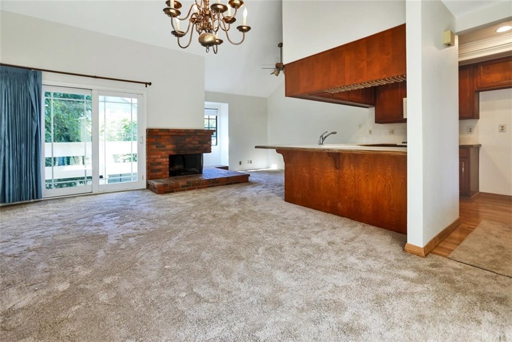 292 Palmer Street, Unit C2 Costa Mesa, CA 92627 - Photo 37 of 40 Open Floor Plan Living Room / Dining Room area with cozy Fireplaces. The large open Kitchen has plenty of space for counter seating as well as a large area for a Dining Set.