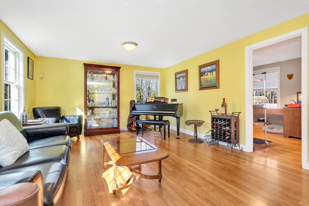 105 Hadley Road Merrimac, MA 01860 - Photo 15 of 31 a living room with furniture and a wooden floor