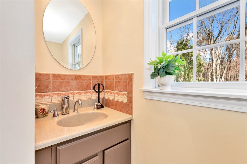 105 Hadley Road Merrimac, MA 01860 - Photo 17 of 31 a bathroom with a sink and a mirror
