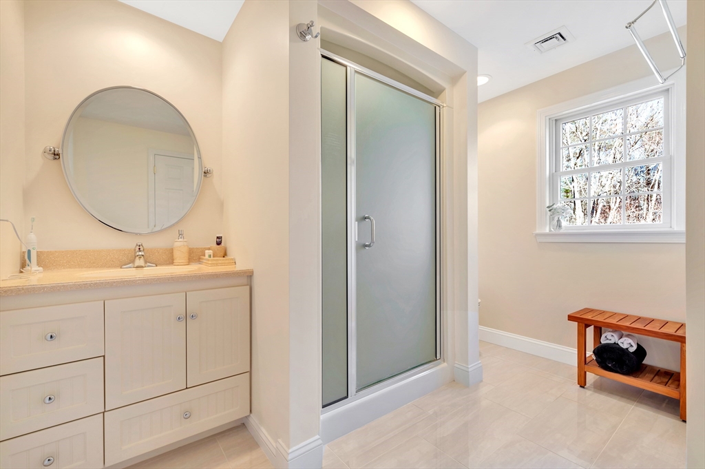 105 Hadley Road Merrimac, MA 01860 - Photo 22 of 31 a bathroom with a double vanity sink and a mirror