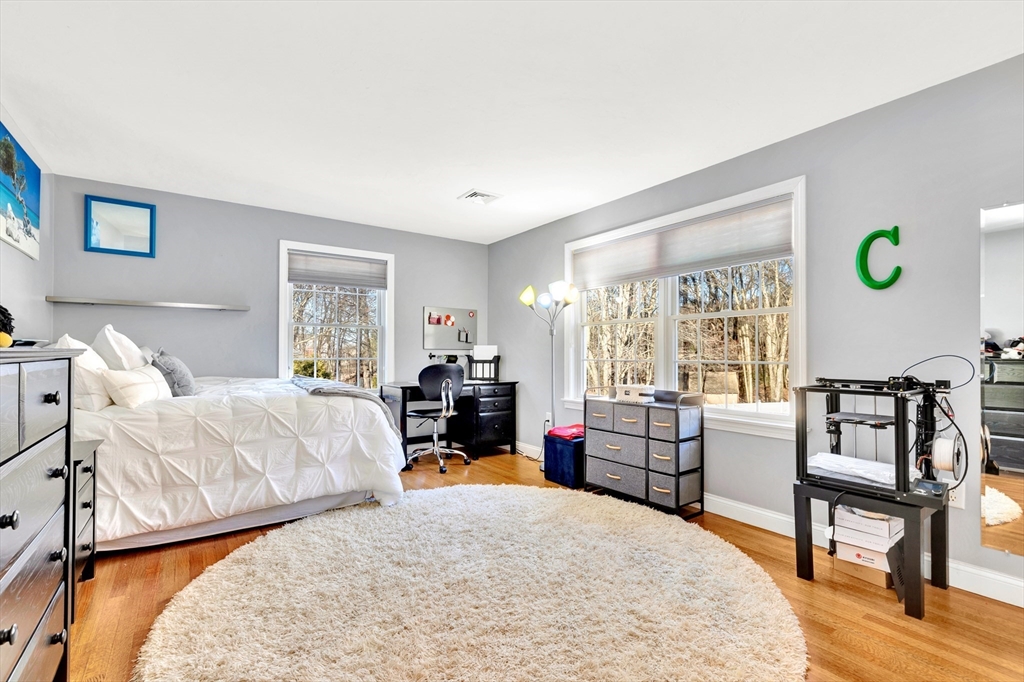 105 Hadley Road Merrimac, MA 01860 - Photo 23 of 31 a bed room with a bed mirror and a window