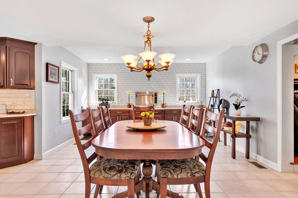 105 Hadley Road Merrimac, MA 01860 - Photo 3 of 31 a view of a dining room with furniture and chandelier