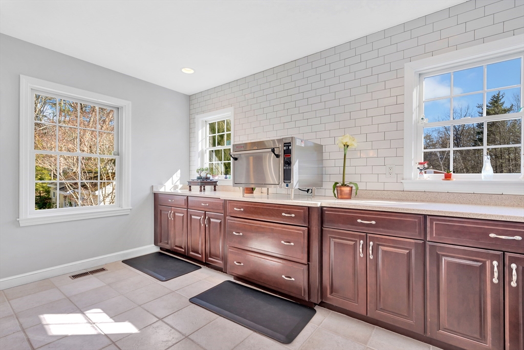 105 Hadley Road Merrimac, MA 01860 - Photo 5 of 31 a spacious bathroom with double vanity and a mirror