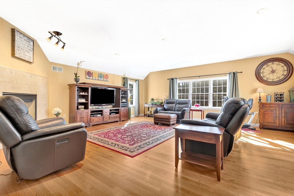 105 Hadley Road Merrimac, MA 01860 - Photo 10 of 31 a living room with furniture and a flat screen tv
