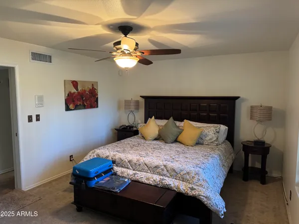 a bathroom with a sink vanity and mirror