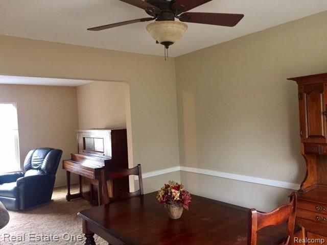 30072 Merrick Warren, MI 48092 - Photo 14 of 27 Spacious formal dining room with updated ceiling fan light fixture, custom moulding, freshly painting with Sherwin Williams neutral color