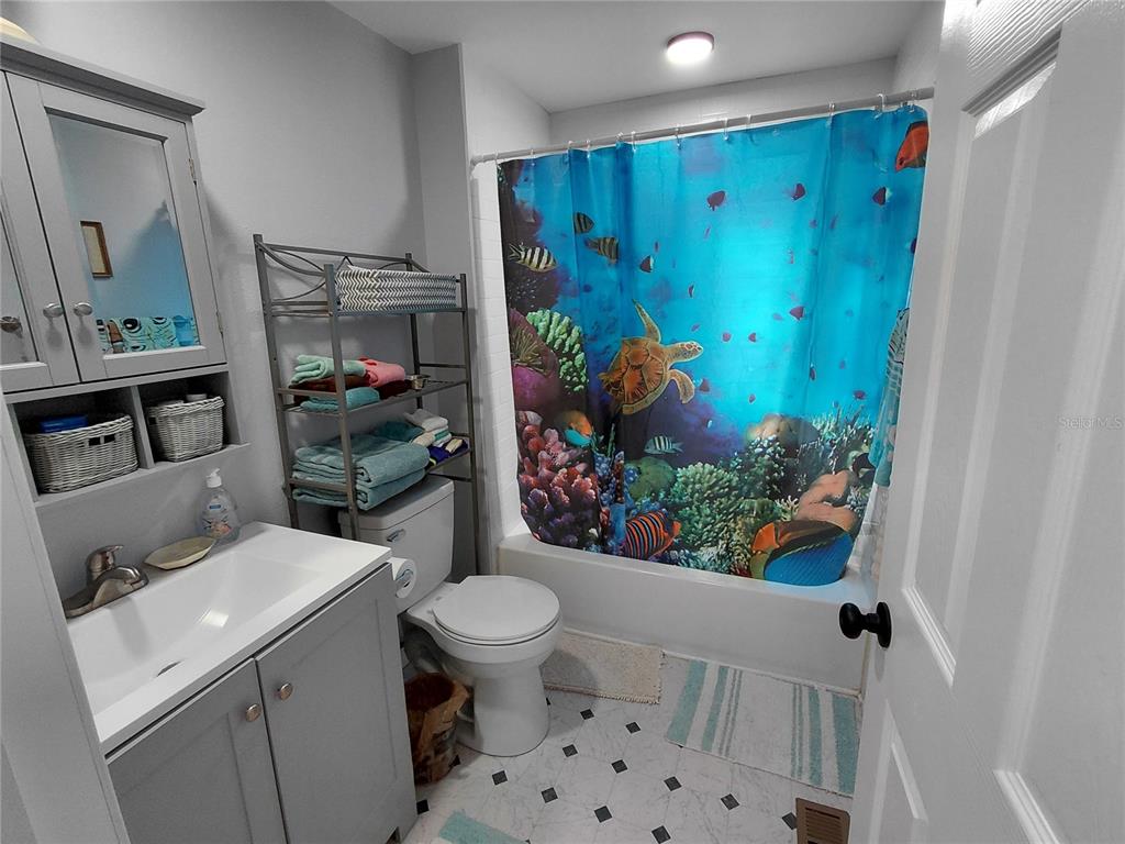 6758 North Capri Loop Hernando, FL 34442 - Photo 13 of 47 a bathroom with a sink toilet and shower