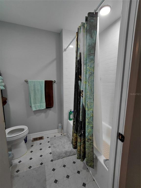 6758 North Capri Loop Hernando, FL 34442 - Photo 27 of 47 a bathroom with a sink toilet and shower