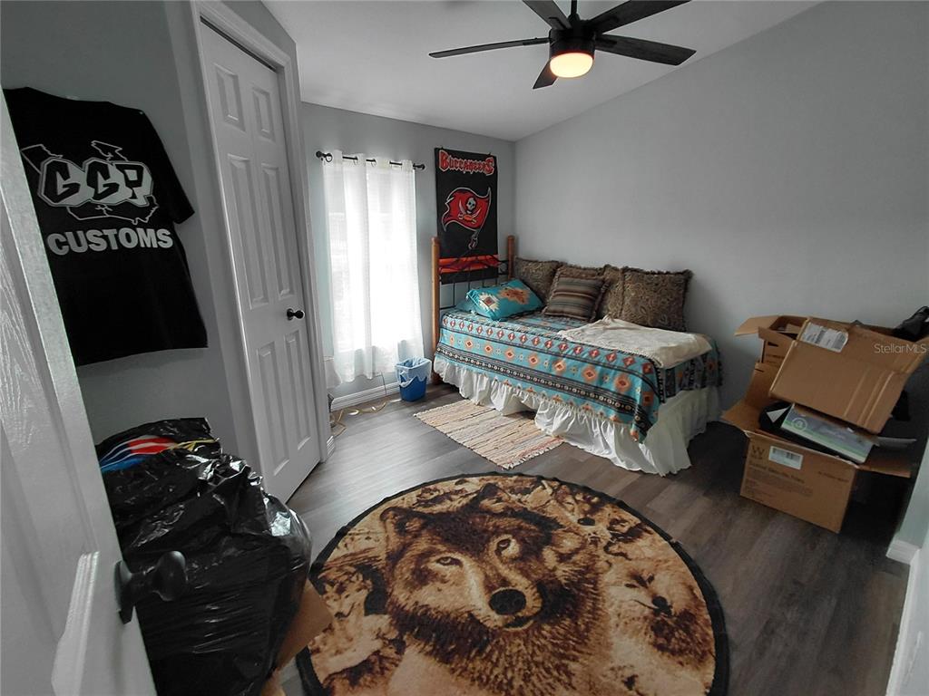 6758 North Capri Loop Hernando, FL 34442 - Photo 31 of 47 a bedroom with bed and a mirror