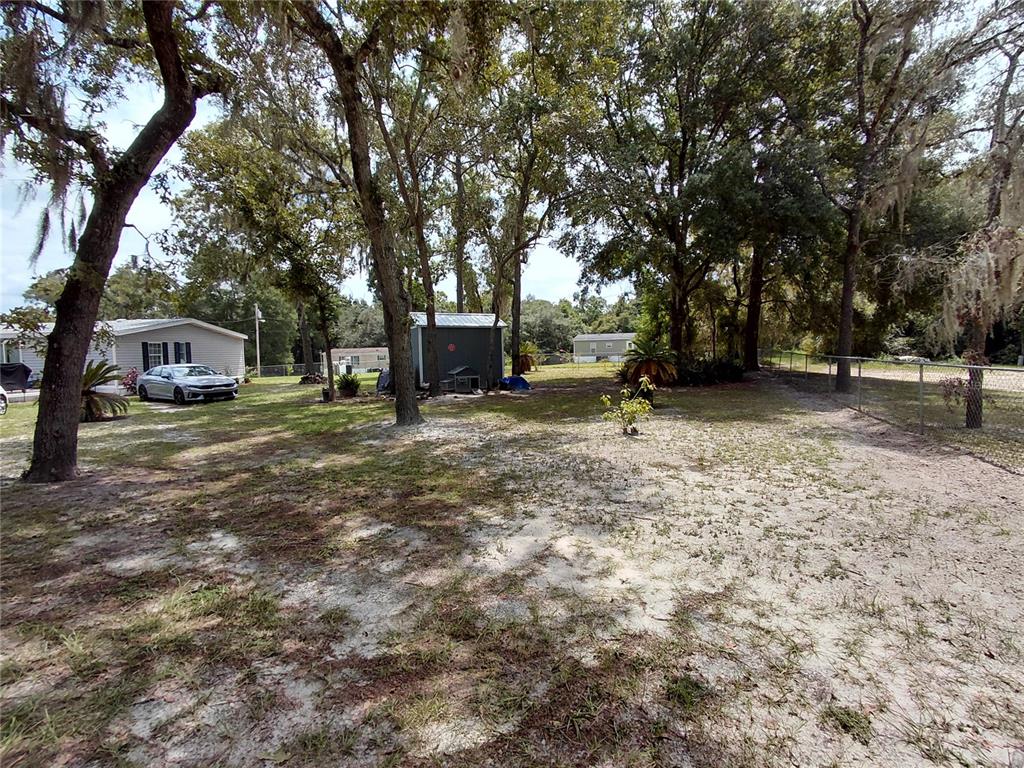 6758 North Capri Loop Hernando, FL 34442 - Photo 34 of 47 a view of a backyard with trees