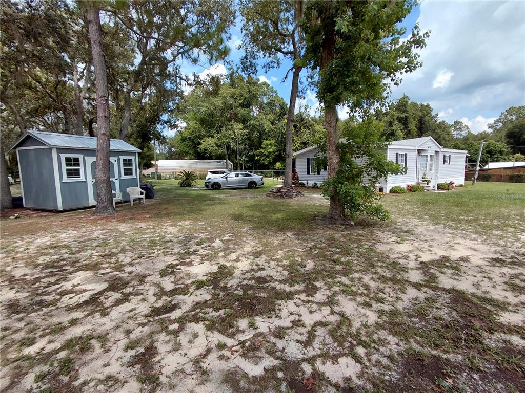 6758 North Capri Loop Hernando, FL 34442 - Photo 36 of 47 a view of a house with a yard