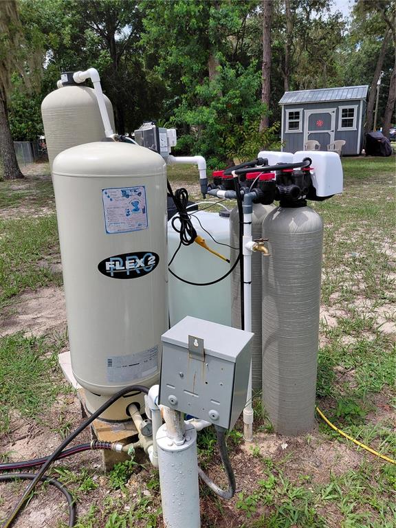 6758 North Capri Loop Hernando, FL 34442 - Photo 47 of 47 a view of a chairs and table in the back yard of the house